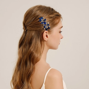 Close-up of bridal hair comb with blue marquise crystals and white rhinestones