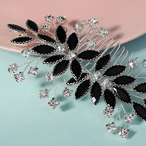 Detail of silver hair comb featuring black marquise stones and sparkling white rhinestones