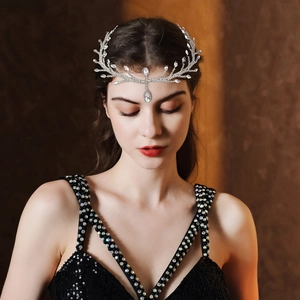 Detailed view of bridal silver headpiece with sparkling crystals and leaf design