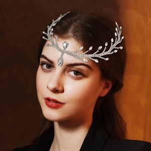 Close-up of silver bridal headpiece with sparkling crystals and elegant leaf motifs