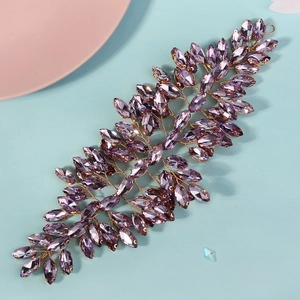 Detailed macro view of purple marquise crystal bridal hair vine with gold wire weave