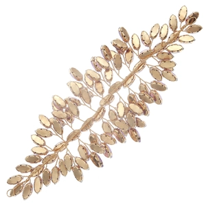 Detailed close-up of champagne crystal rhinestones on a gold wire bridal hair vine