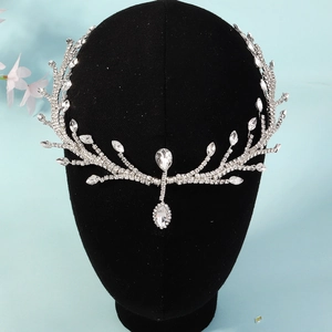 Close-up of silver bridal headpiece with sparkling rhinestones and teardrop crystals