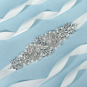 Luxurious bridal sash with sparkling rhinestones and pearls on a white satin ribbon