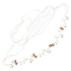 Detailansicht des Braut-Haarbands mit goldenen Blumen, Kristallperlen und weißem Organza-Band
