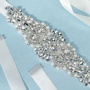 Luxurious bridal belt featuring hand-sewn rhinestones and pearls on white silk ribbon