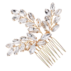 Detailed view of handmade gold wire hair comb with marquise crystal leaf design