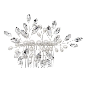 Close-up of handmade bridal hair comb with pearls and marquise-cut crystals in silver finish