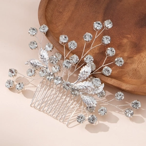 Elegant bridal hair comb with silver leaves and sparkling rhinestones for wedding styling