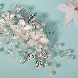 Elegant bridal hair comb with silver flowers and white pearls for wedding and parties