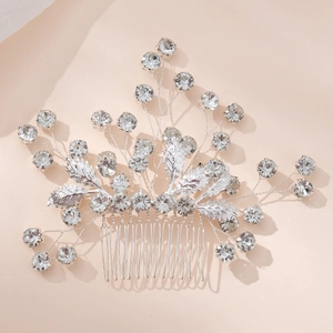 Silver bridal hair comb with rhinestone leaves and floral design for wedding hairstyling
