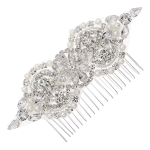 Handmade bridal hair comb with silver rhinestones and pearls on white mesh background