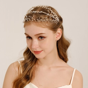 Elegant bridal headband with pearls and crystals in a golden vine design for weddings