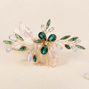 Peigne à cheveux doré de mariée avec cristaux verts et détails de plumes