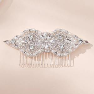 Elegant bridal hair comb with sparkly rhinestones and white pearls on silver metal base