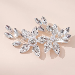 Elegant silver bridal hair clip with crystal flowers and pearls for wedding hairstyles