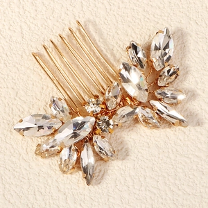 Elegant bridal hair comb with gold base and sparkling marquise crystals in floral wing shape