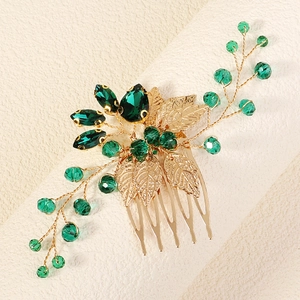 Peigne à cheveux de mariée doré élégant avec strass vert émeraude et motifs de feuilles