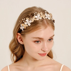 Handmade golden floral headband with pearls and white enamel flowers for weddings