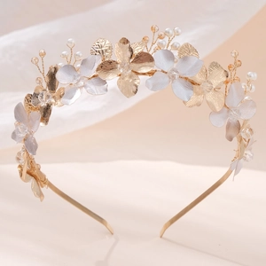 Elegant gold metal flower headband with crystal and pearl accents for party or wedding