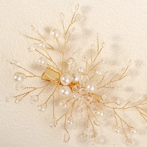 Elegant bridal hair clip with handmade gold wire branches, pearls, and crystal drops