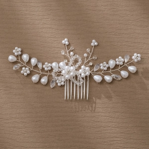 Detail of bridal hair comb with pearls and marquise rhinestones on silver wire