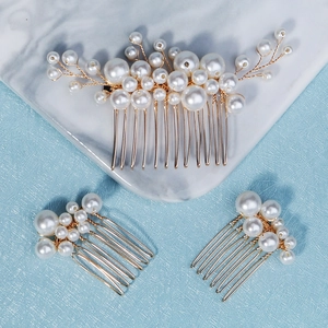 Three-piece set featuring handmade pearl hair combs with gold wire and marquise rhinestones