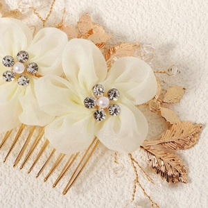 Elegant bridal hair comb with cream fabric flowers, pearls and crystals for wedding hairstyles