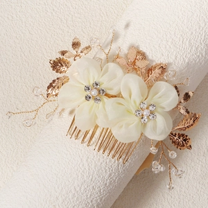 Elegant bridal hair comb with ivory fabric flowers, crystals and gold metal leaves