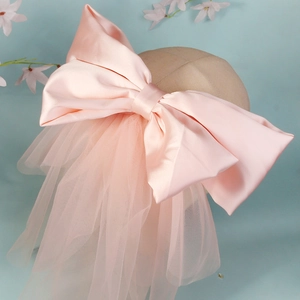 Elegant large pink satin bow wedding veil for brides with layered romantic soft mesh tulle
