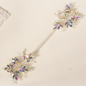 Detail of hand-woven bridal headband with iridescent marquise crystals and silver wires