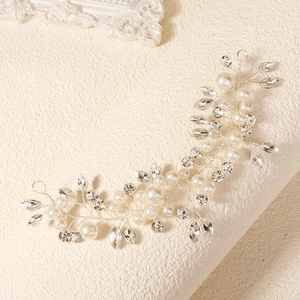 Exquisite bridal hair vine with white pearls and sparkling crystals on silver wire