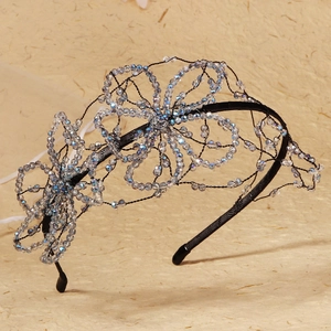 Detailed view of blue crystal flower headband with handcrafted mesh beadwork