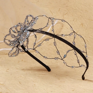 Detail of floral mesh hairband with crystal beads and black metal wire construction
