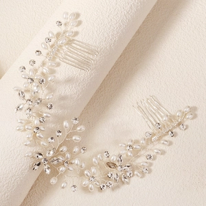 Detail of bridal hair vine with handmade pearls, rhinestones and silver metal combs