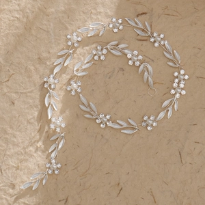 Silver bridal hair vine with white leaves, pearls and crystal flowers for wedding hair