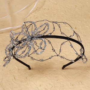 Elegant floral beaded headband with clear crystal petals for wedding and party
