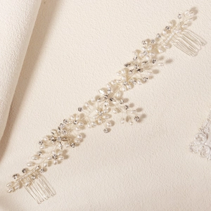 Detail of bridal hair comb with handmade white pearls and crystal floral branches