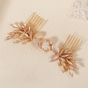 Champagne gold bridal hair comb with elegant metal leaves and white pearl flower accents