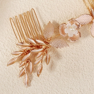 Luxurious gold floral bridal hair comb with metal leaves and white faux pearls decor