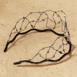 Detail of luxury bridal headband with black mesh crown and crystal bead embellishments