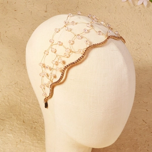 Luxurious handmade gold wire bridal headband with pink crystals and sparkling rhinestones