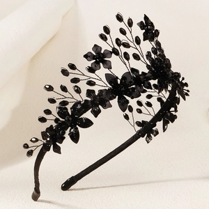 Detail of gothic black floral headband with handcrafted beads and branch wire design