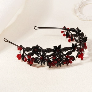 Close-up of gothic branch crown with red crystals for Halloween party hair styling