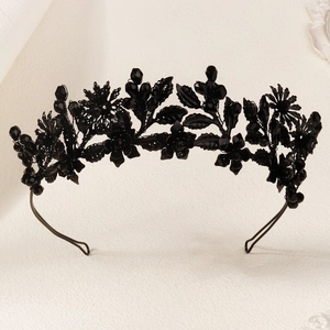 Detailed view of Gothic black floral crown with crystals and dark metal leaves