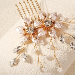Elegant gold bridal hair comb with enamel flowers, zircons, and pearl tassels