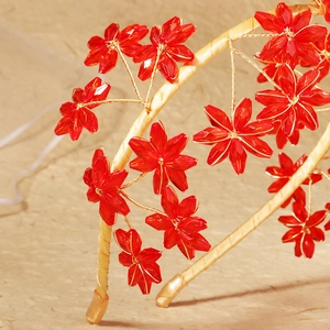 Luxurious handmade bridal headband with red crystal flowers and gold wire on satin base