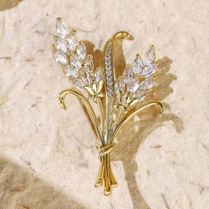 Macro shot of gold wheat ear brooch detailing high-quality sparkling zircon stones