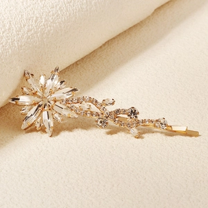 Elegant gold bridal hair clip with snowflake rhinestone vine design for weddings