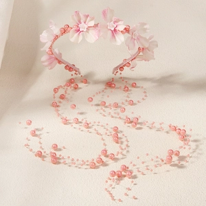 Serre-tête floral rose avec longues pampilles de perles pour coiffure de mariée et fête